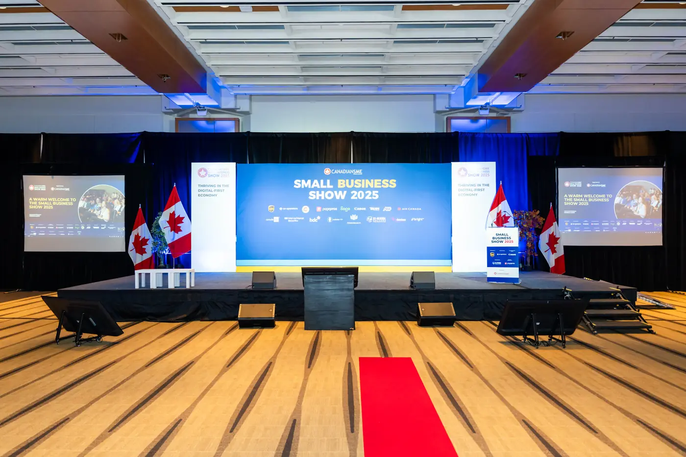 Ballroom main stage with LED backdrop, side screens and red carpet before doors open